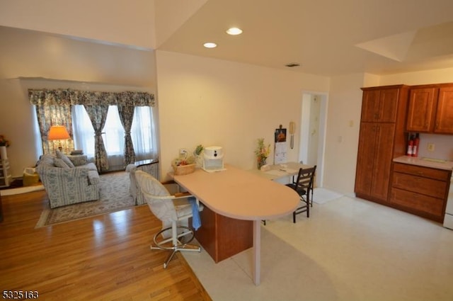 dining space with light hardwood / wood-style floors