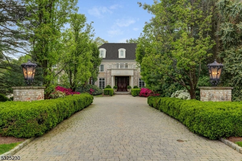 view of front of home featuring french doors and a balcony