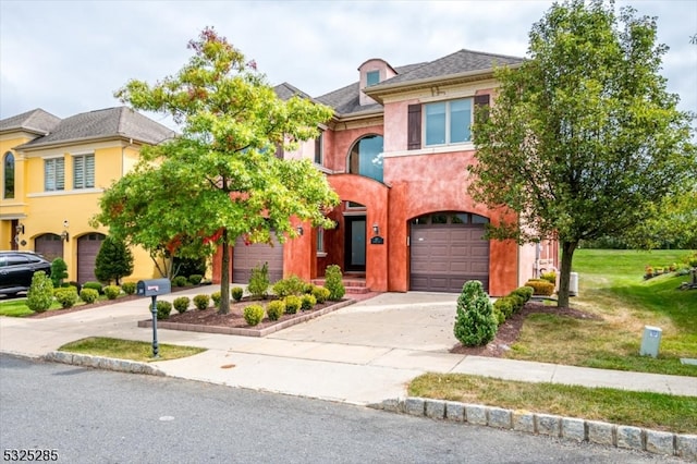 view of front of house with a garage and a front yard