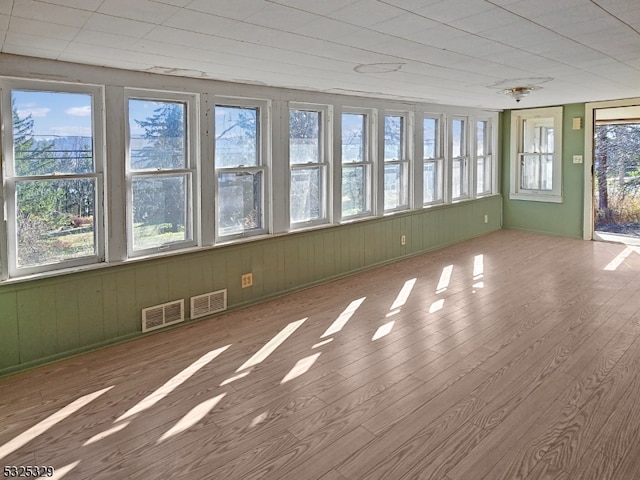 unfurnished sunroom with a healthy amount of sunlight