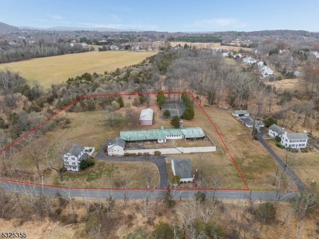 birds eye view of property featuring a rural view