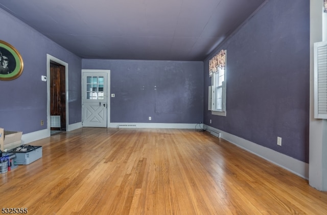 unfurnished living room featuring light wood-type flooring