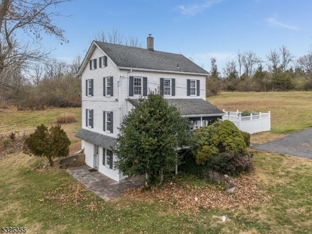 view of property exterior featuring a lawn