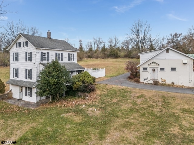 view of home's exterior featuring a yard