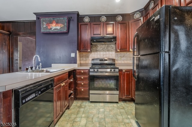 kitchen featuring black appliances, backsplash, and sink