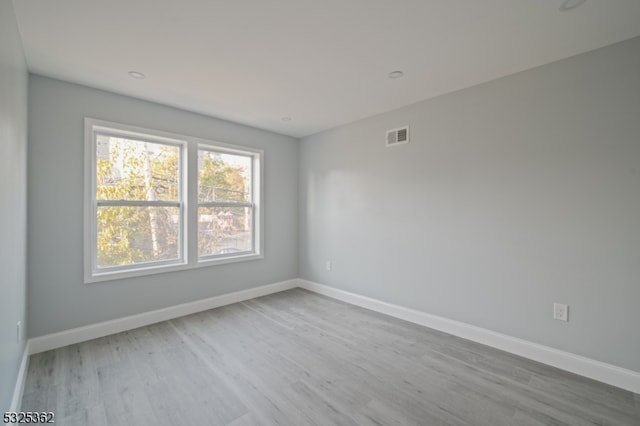 empty room with light wood-type flooring