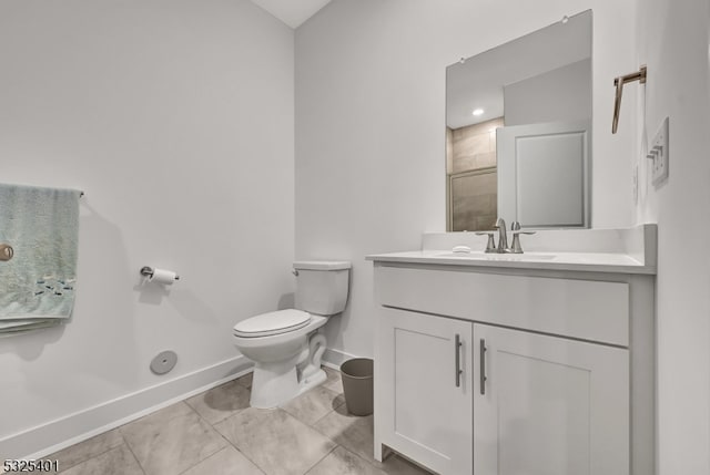 bathroom with vanity, toilet, and a shower with shower door