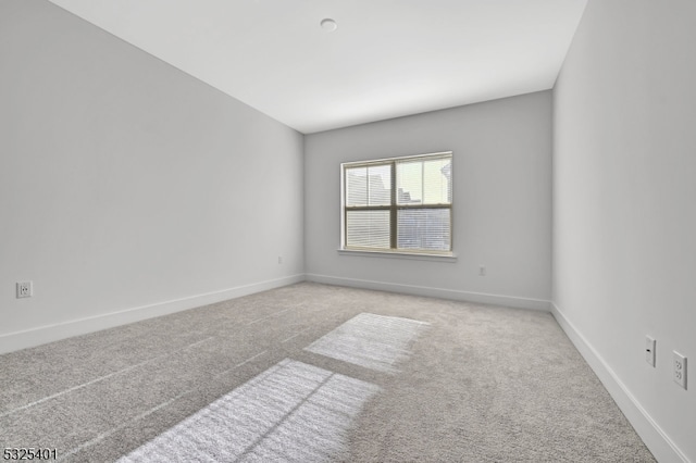 empty room featuring light carpet