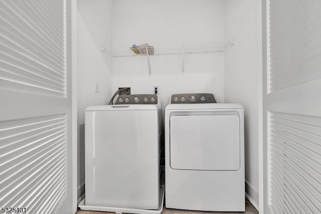 washroom featuring independent washer and dryer