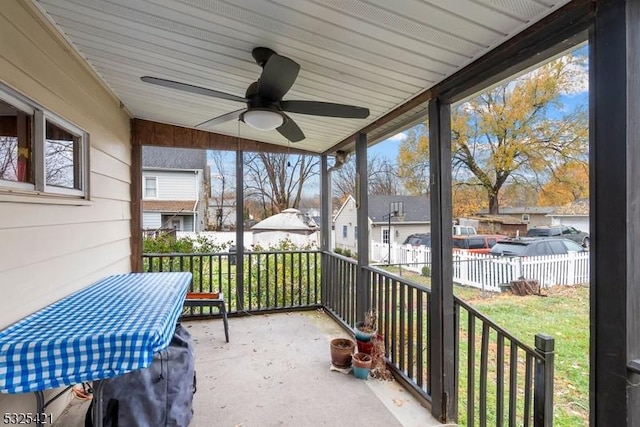 sunroom / solarium with ceiling fan