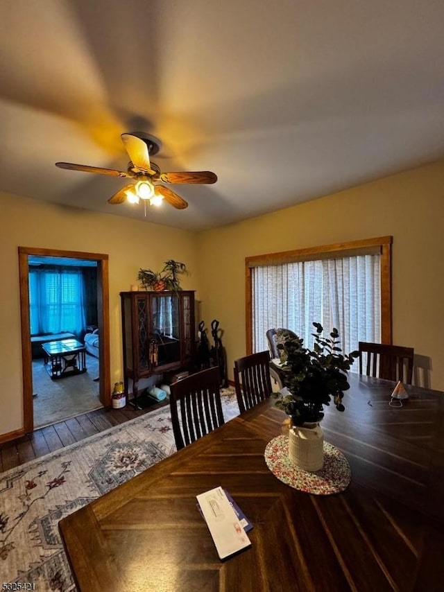 dining space featuring hardwood / wood-style floors and ceiling fan