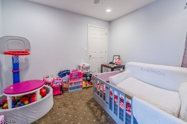 playroom with carpet flooring and ceiling fan