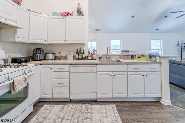 kitchen featuring white cabinets, white appliances, sink, and dark wood-type flooring