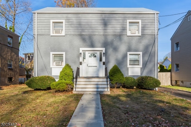 view of front of home with a front yard