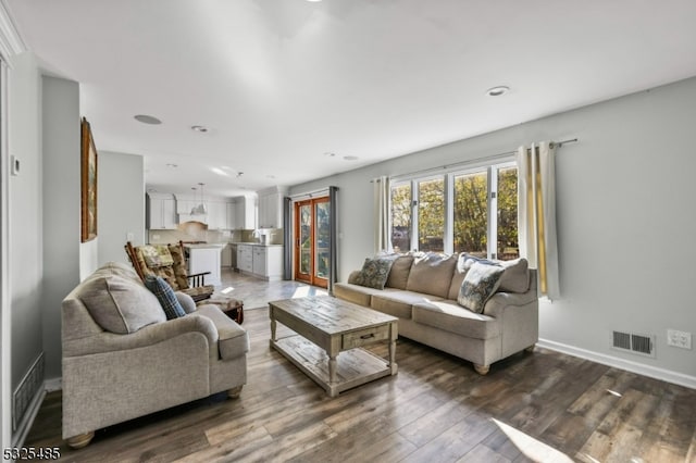 living room with dark hardwood / wood-style flooring