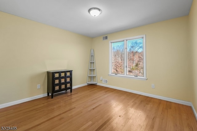 unfurnished room featuring light hardwood / wood-style floors