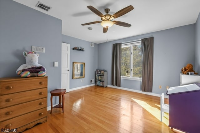 bedroom featuring ceiling fan and hardwood / wood-style flooring