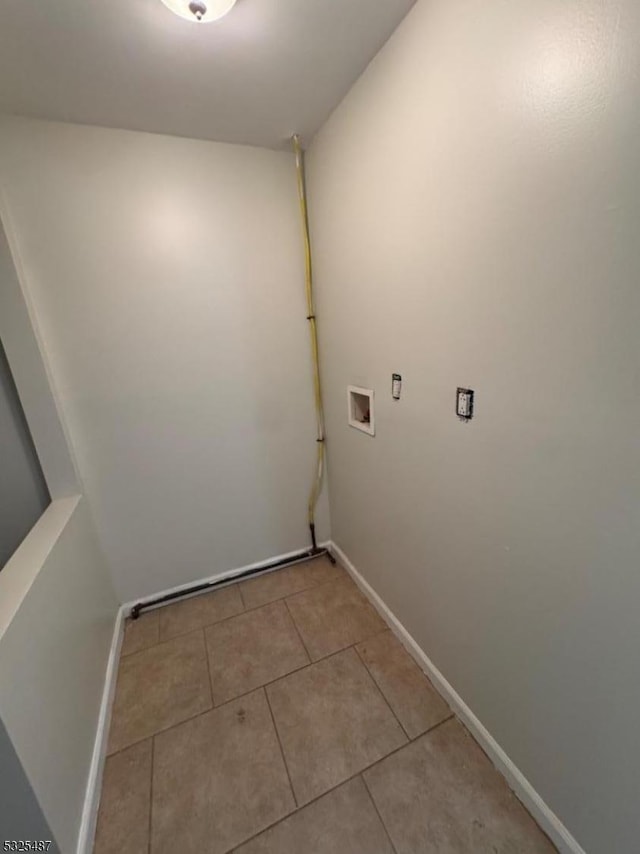 laundry area featuring washer hookup and light tile patterned flooring