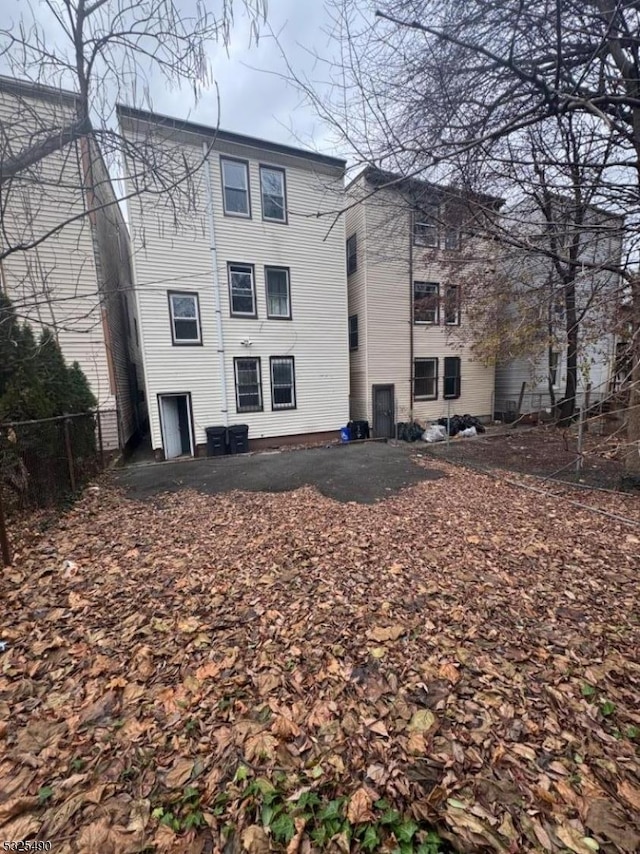 back of property featuring central air condition unit