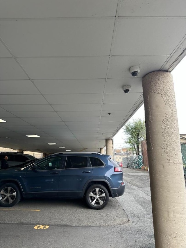 view of vehicle parking featuring a carport