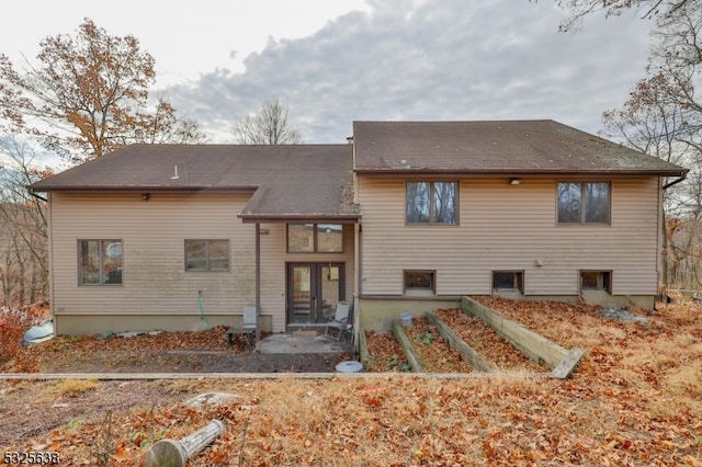 back of property with a patio area and french doors