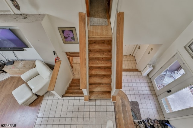 stairs featuring tile patterned floors