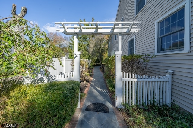 view of property exterior featuring a pergola