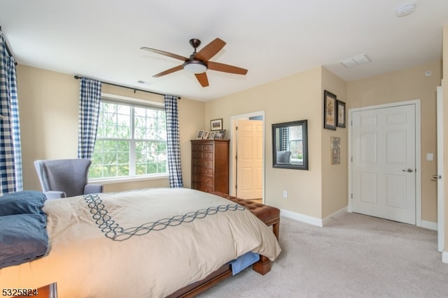 bedroom featuring ceiling fan and light colored carpet