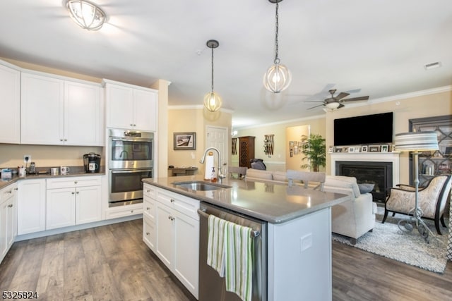 kitchen featuring white cabinets, dark hardwood / wood-style floors, sink, and appliances with stainless steel finishes