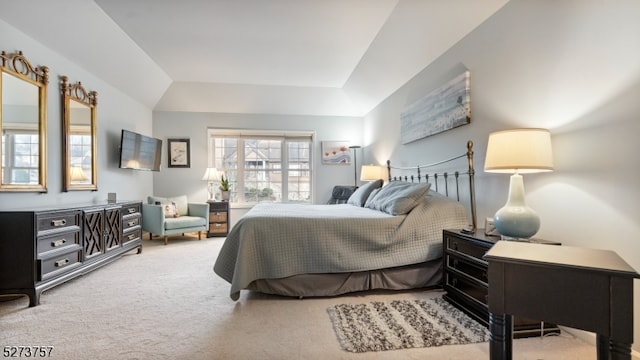 bedroom with carpet and vaulted ceiling