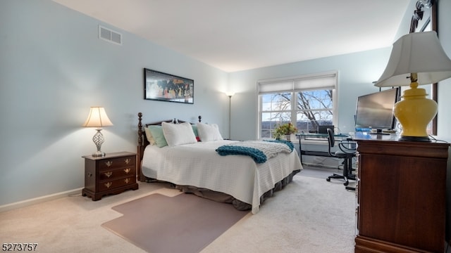 bedroom with light carpet