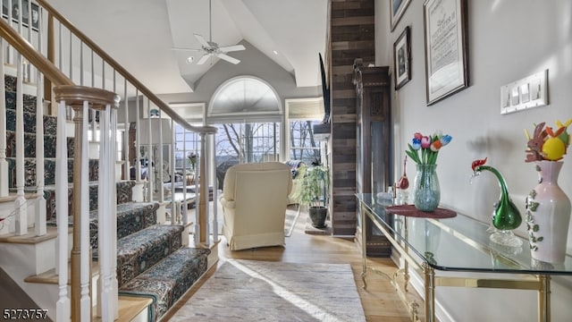 interior space featuring light wood-type flooring, high vaulted ceiling, and ceiling fan