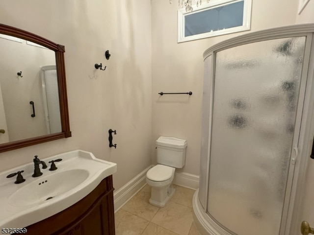 bathroom featuring vanity, toilet, and walk in shower