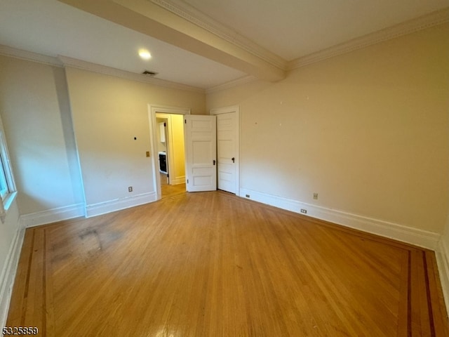 unfurnished room featuring light hardwood / wood-style floors and ornamental molding