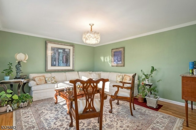 interior space with hardwood / wood-style flooring, crown molding, and a chandelier