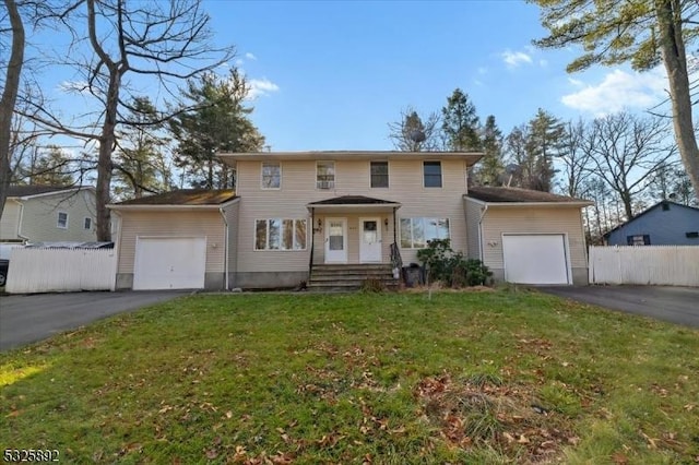 view of front of home featuring a garage and a front lawn