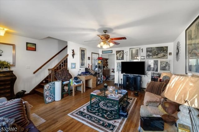 living room featuring ceiling fan and wood-type flooring