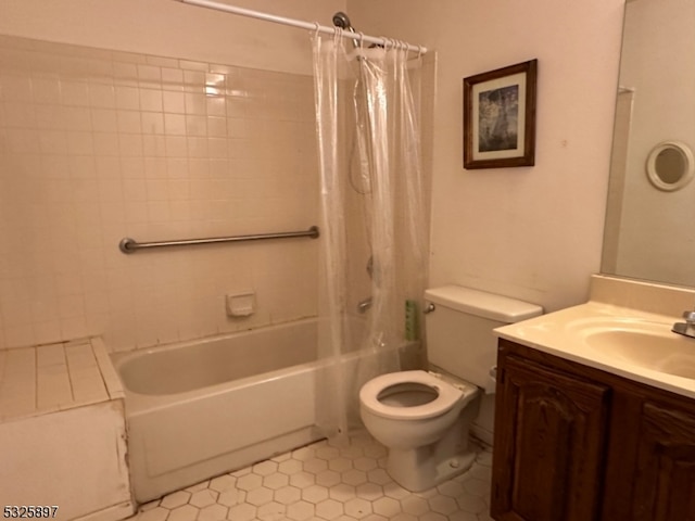 full bathroom featuring tile patterned floors, shower / bath combo with shower curtain, vanity, and toilet