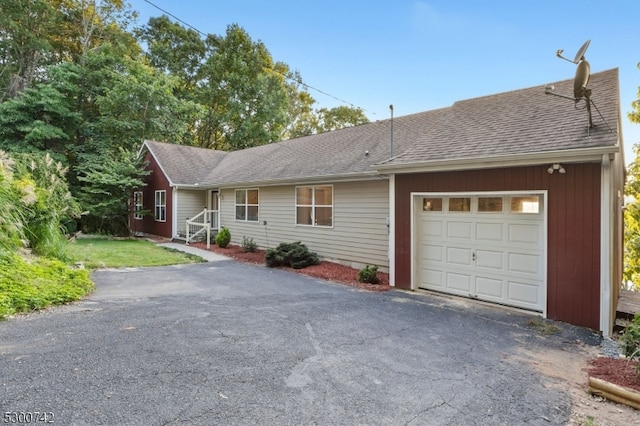 single story home featuring a garage