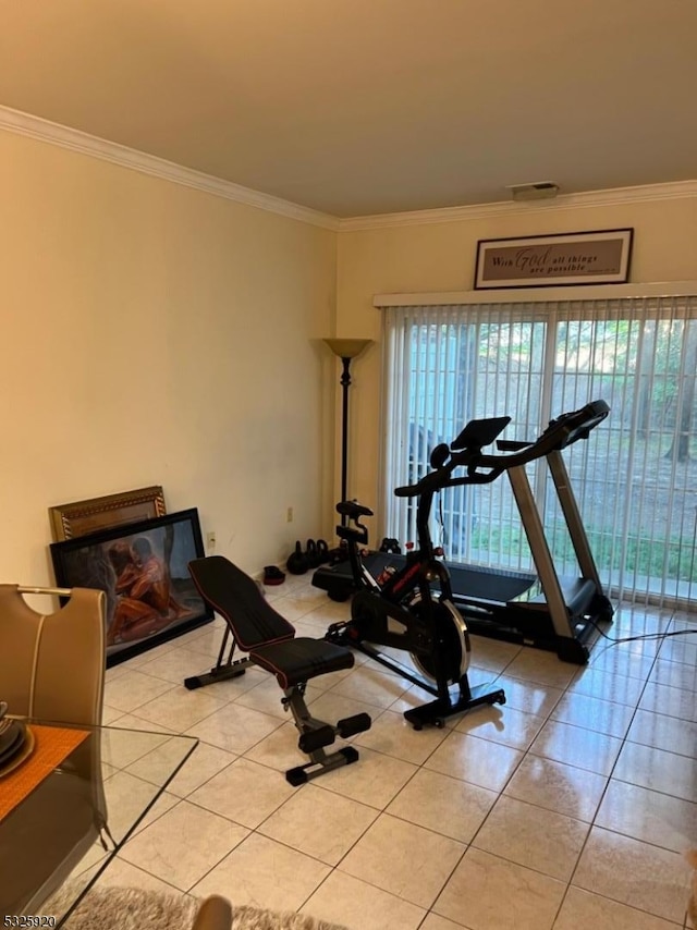 workout room with light tile patterned floors and ornamental molding