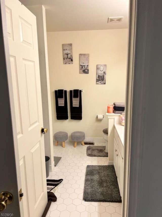 bathroom with tile patterned flooring and vanity