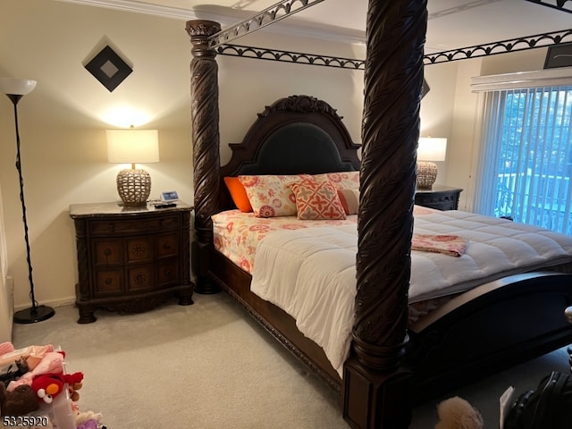 carpeted bedroom featuring ornamental molding