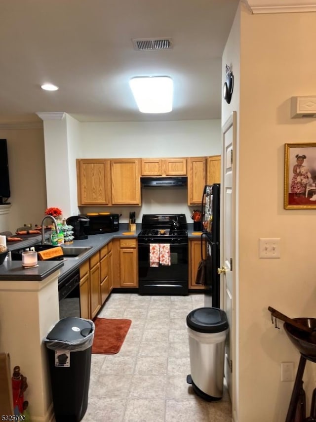 kitchen featuring kitchen peninsula, sink, black appliances, and ornamental molding