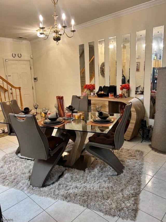 dining area featuring a notable chandelier, ornamental molding, and light tile patterned floors