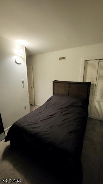 bedroom with a closet and carpet floors