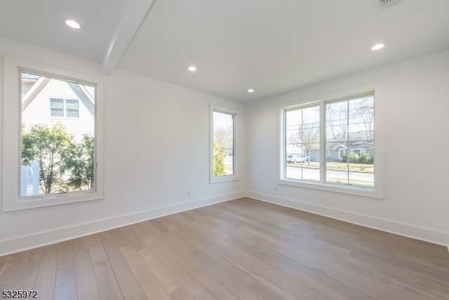 unfurnished room featuring wood-type flooring