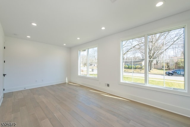 spare room with light wood-type flooring