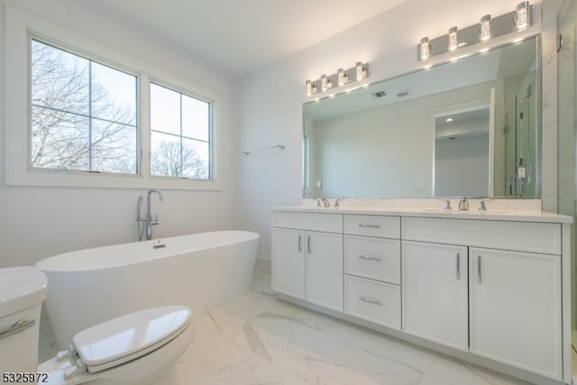 full bathroom featuring vanity, independent shower and bath, and toilet