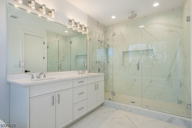 bathroom with an enclosed shower and vanity