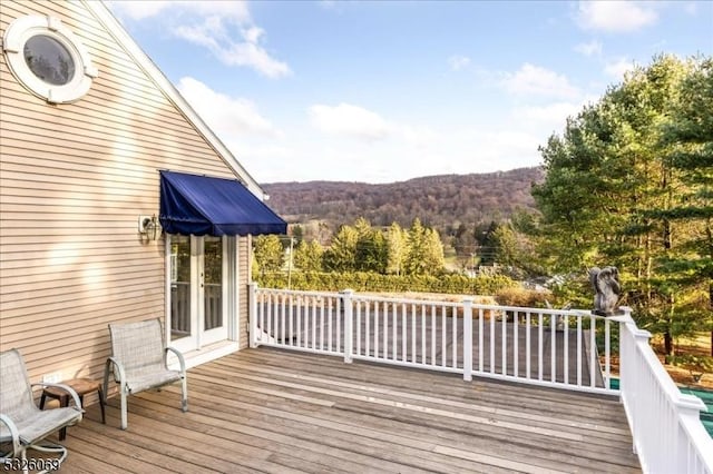 wooden terrace featuring a mountain view